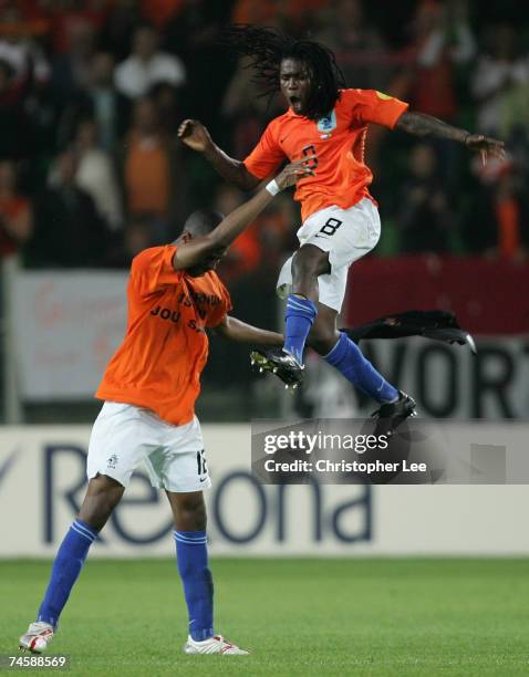 Royston Drenthe of the Netherlands is thrown into the air by his team mate Ryan Donk as they celebrate their victory during the UEFA U21 Championship...