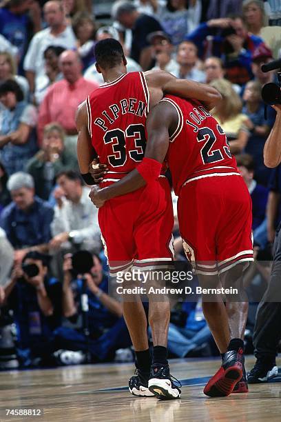 Scottie Pippen and Michael Jordan of the Chicago Bulls embrace after a big win in the 1997 NBA season. NOTE TO USER: User expressly acknowledges...
