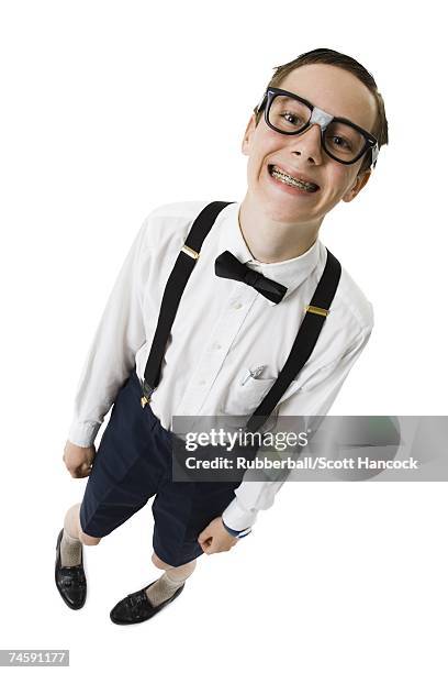 male nerd with suspenders and tape on eyeglasses smiling with braces - boys with braces stock pictures, royalty-free photos & images