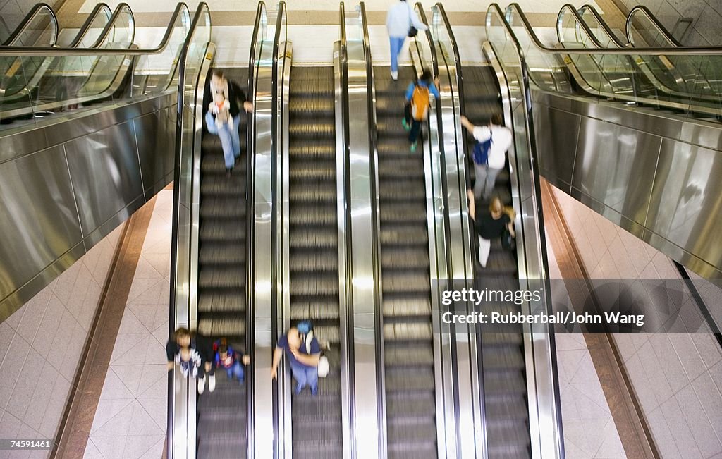 Escalators with people and motion blur