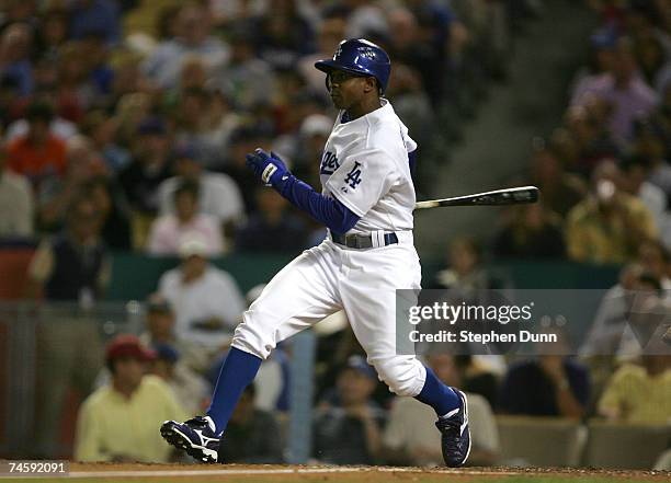 Juan Pierre of the Los Angeles Dodgers hits an RBI single against the New York Mets at Dodger Stadium June 13, 2007 in Los Angeles, California.