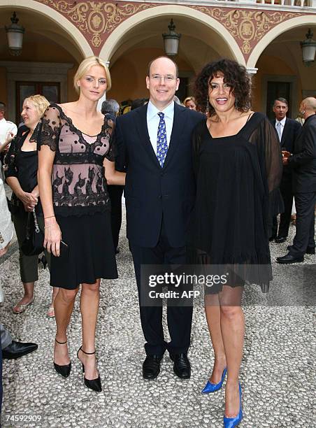Prince Albert II of Monaco, Charlene Wittstock and actress Viktor Lazlo pose, 13 june 2007 at Monaco, during a reception for the 47th Monte Carlo...