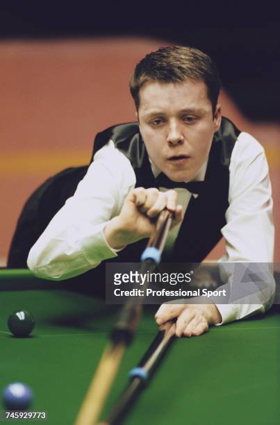 Scottish professional snooker player John Higgins pictured in action during competition in the 1996 Embassy World Snooker Championship at the...