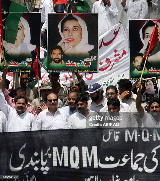 Activists of Pakistan People?s Party hold portraits of their party leader and former Prime Minister Benazir Bhutto as they march during a protest...