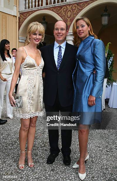 In this handout released by the 2007 TV Festival Organization, actress Kathryn Morris, Prince Albert II of Monaco and actress Kristanna Loken pose in...