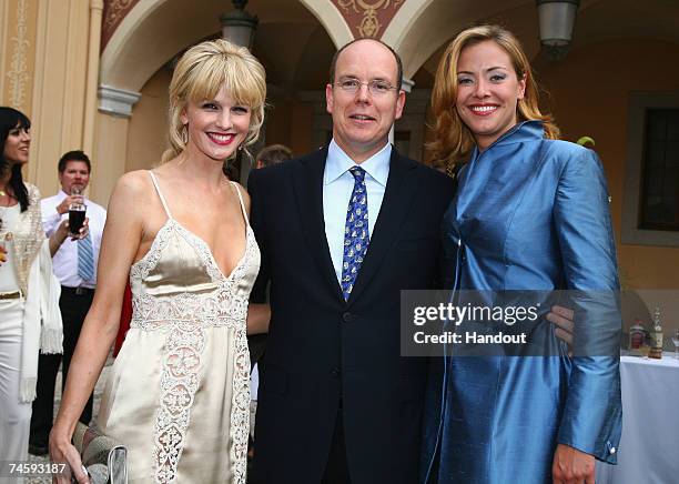 In this handout released by the 2007 TV Festival Organization, actress Kathryn Morris, Prince Albert II of Monaco and actress Kristanna Loken pose in...