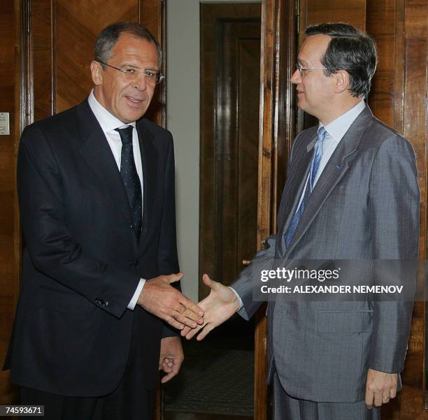 Moscow, RUSSIAN FEDERATION: OSCE Secretary-General Marc Perrin de Brichambaut shakes hands with Russian Foreign Minister Sergei Lavrov during their...