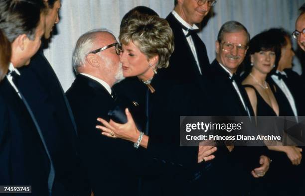 Princess Diana kisses British actor and director Richard Attenborough at the London premiere of Steven Spielberg's film 'Jurassic Park', 15th July...