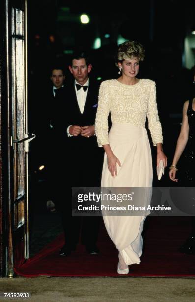 Princess Diana , wearing a Catherine Walker evening dress, arriving with Prince Charles at the Dominion Theatre, London for the Royal Variety...