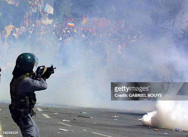 - Picture taken 21 July 2001 of a Guarda di Finanza aiming at anti-globalisation activists during a protest against the G8 summit in Genoa .In 2001,...