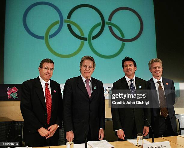 International Olympic Committee members Gilbert Felli and Denis Oswald join Lord Sebastian Coe, the London 2012 Organizing Committee chairman, and...