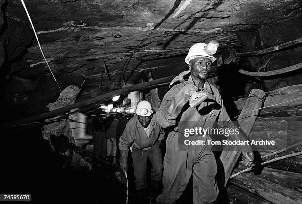 Miners underground at a Lonmin Platinum mine in South Africa, June 2003.