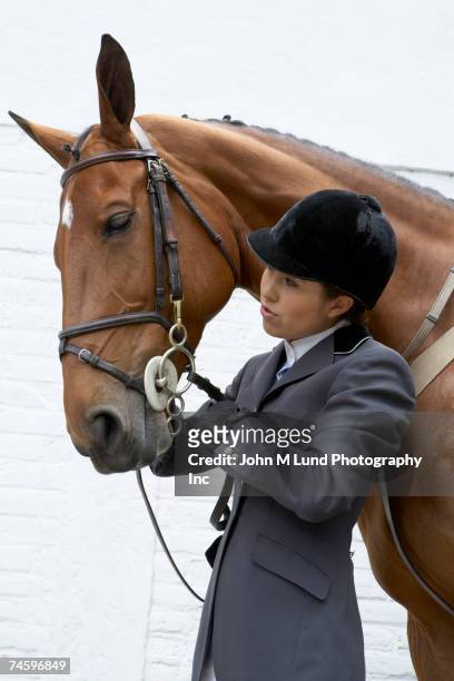 hispanic female equestrian and horse - 乗馬帽 ストックフォトと画像