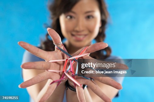 Watch A String Young Woman Plays With Colored String High-Res Stock Photo - Getty Images