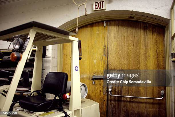 The doors to the Norris Hall machine shop remain closed and bolted ahead of the phased re-use of building June 14, 2007 in Blacksburg, Virginia. On...