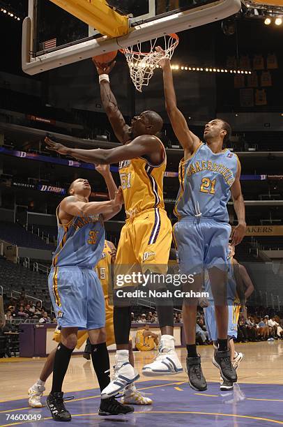 Babacar Camara of the Los Angeles D-Fenders hooks a shot between Roderick Riley and Anthony Coleman of the Bakersfield Jam on March 25, 2007 at...