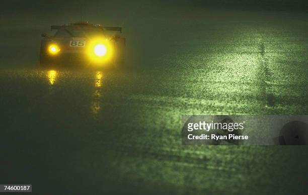 The Team Spyker car of Andrea Chiesa of Switzerland, Alex Caffi of Italy and Andrea Belicchi of Italy drives the rain during the second qualifying...