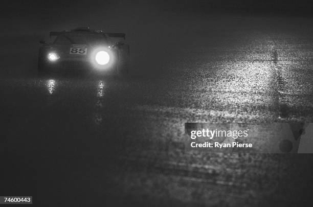 The Team Spyker car of Andrea Chiesa of Switzerland, Alex Caffi of Italy and Andrea Belicchi of Italy drives the rain during the second qualifying...