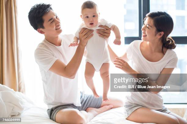 happy young family - couple portrait soft ストックフォトと画像