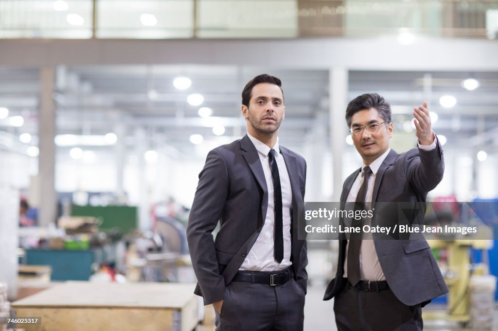 Business people talking in the factory