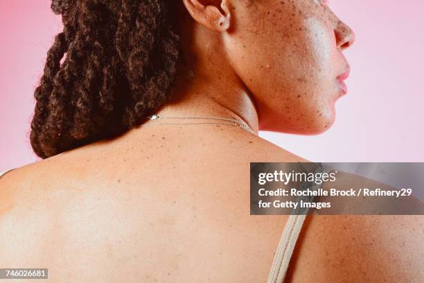 portrait of a young womans back with freckles - human skin back stock pictures, royalty-free photos & images