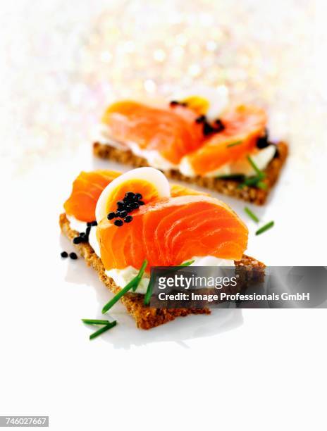 whole-grain bread with cottage cheese, salmon, egg and caviar - canap�� stock pictures, royalty-free photos & images