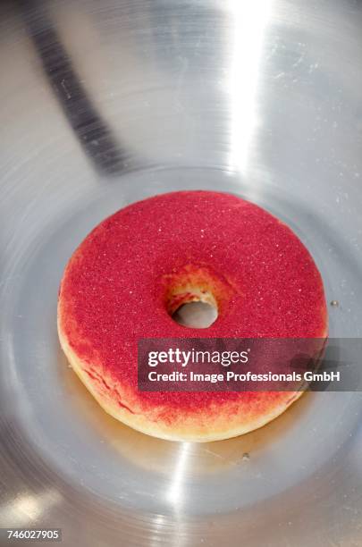 a doughnut dusted with cassis poweder - cassis fruit stock-fotos und bilder