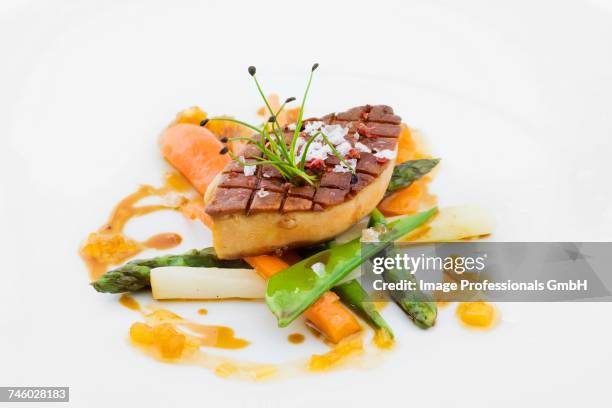 fried foie gras on spring vegetables - liver offal stock pictures, royalty-free photos & images