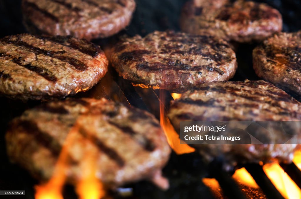 Hamburgers on barbeque grill