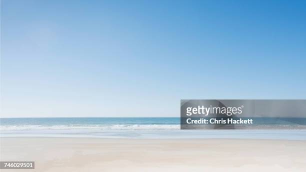empty beach at surf city - clear sky stock-fotos und bilder