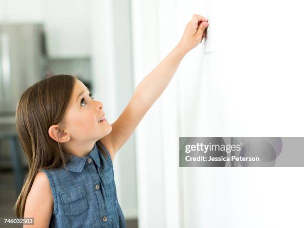 girl (6-7) switch on light - off stock pictures, royalty-free photos & images