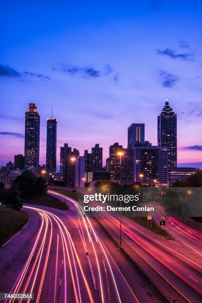 usa, georgia, atlanta, city skyline at dusk - atlanta traffic stock pictures, royalty-free photos & images