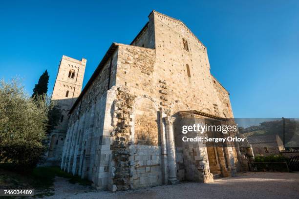 italy, tuscany, montalcino, facade of abbey of santantimo near montalcino city - abbazia di santantimo foto e immagini stock