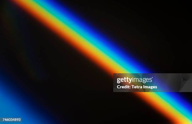 rainbow light against black - prisma stockfoto's en -beelden