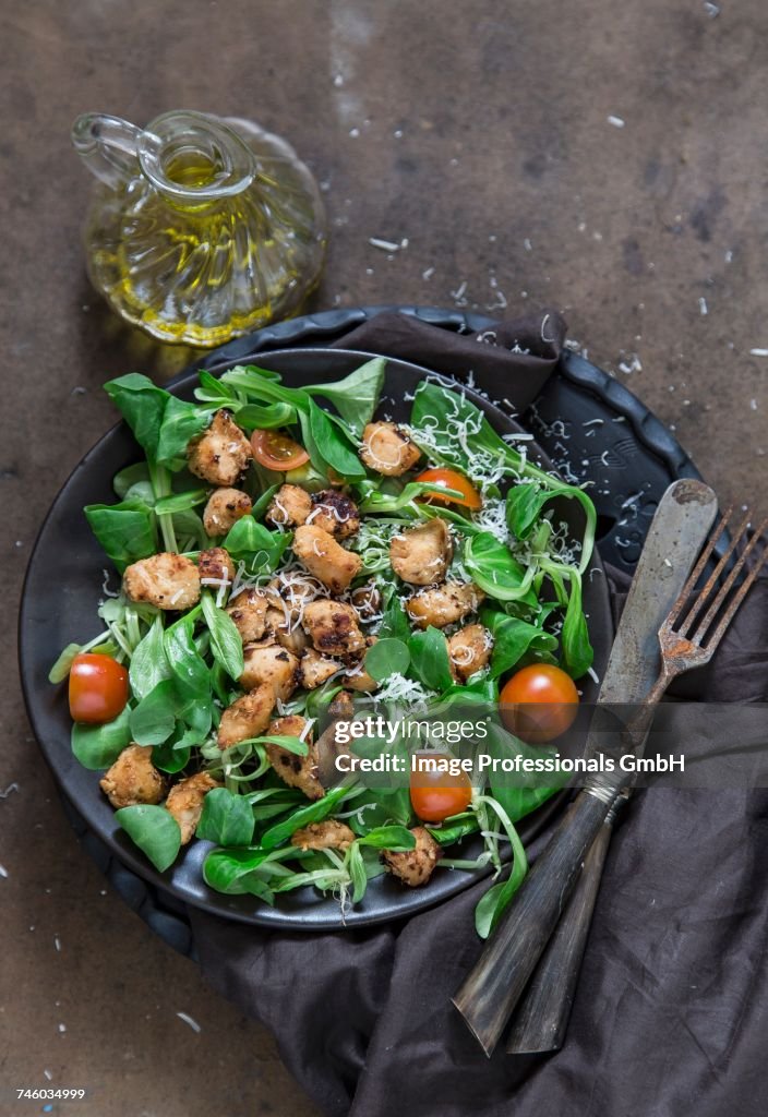 Lambs leaf lettuce with chicken, cherry tomatoes and Parmesan cheese