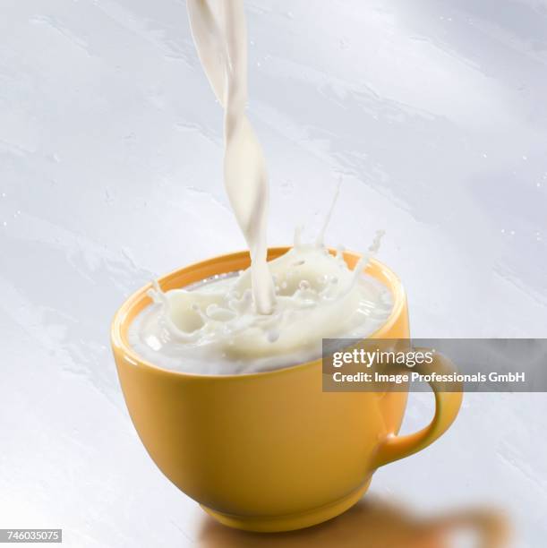 a stream of milk - milk stream stock pictures, royalty-free photos & images