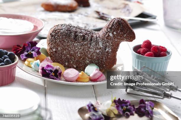 a baked easter lamb with meringue dots on a serving platter - lamb stock-fotos und bilder