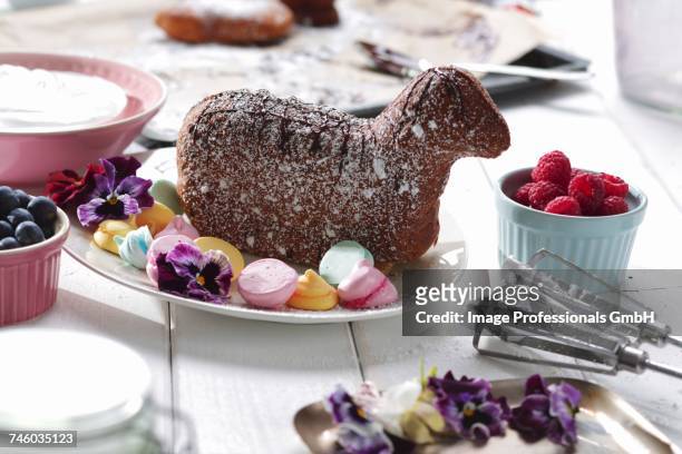 a baked easter lamb with meringue dots on a serving platter - easter lamb stock pictures, royalty-free photos & images