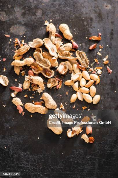 peanuts, some shelled - shelled peanuts stock pictures, royalty-free photos & images