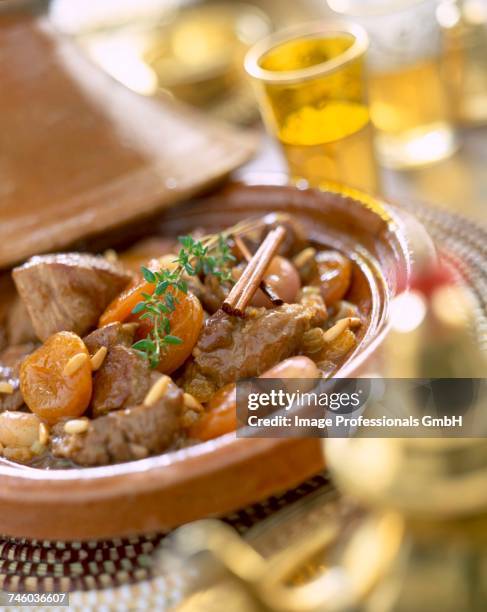 lamb tajine with dried fruit - lamb meat stock pictures, royalty-free photos & images