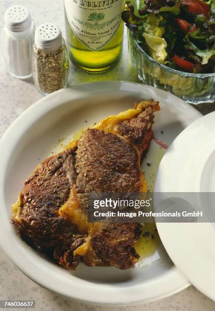 grilled steak with olive oil and salad - entrecôte stock pictures, royalty-free photos & images