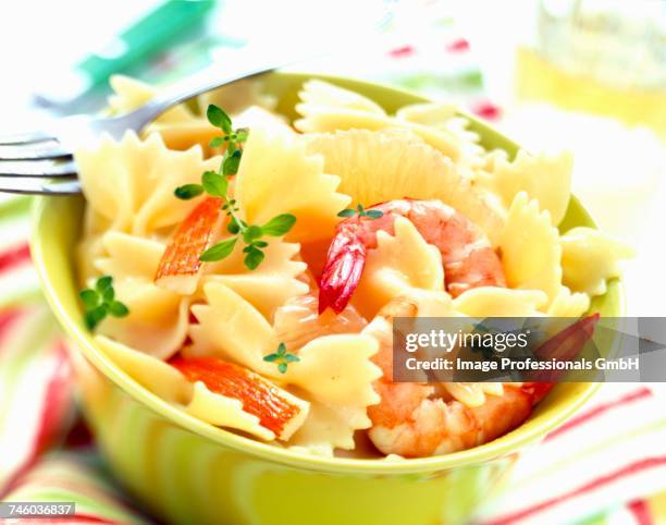 pasta bow salad with prawns and surimi - crab stick stock pictures, royalty-free photos & images