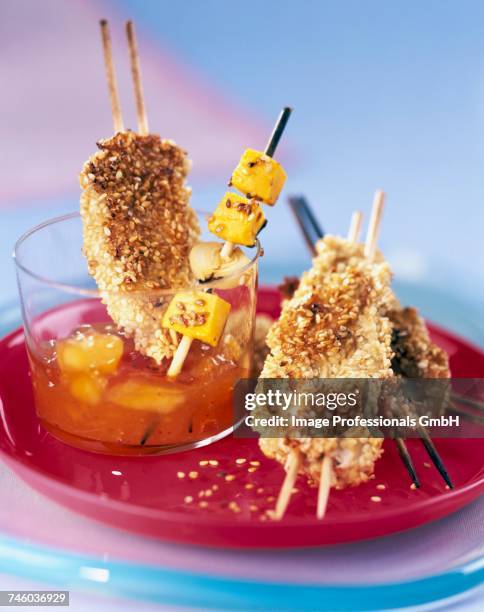 chicken breast skewers with sesame seeds and mango chutney - mango stock pictures, royalty-free photos & images