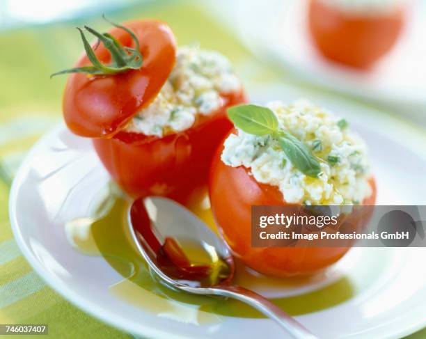 tomatoes stuffed with feta - fetta stockfoto's en -beelden