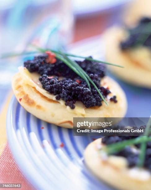 mini blinis and lumpfish roe - canap�� stock pictures, royalty-free photos & images