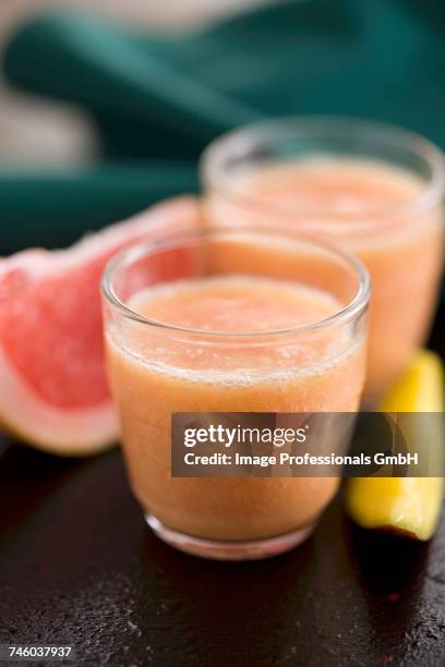 grapefruit,banana and mango smoothie - mango stock pictures, royalty-free photos & images