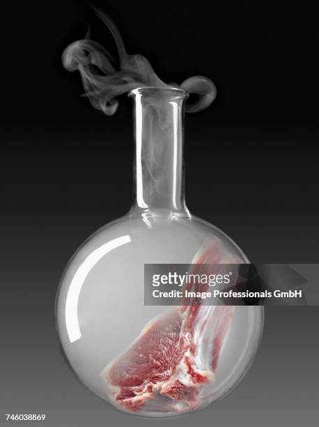 meat in a glass chemical testing bottle - molecular gastronomy stock-fotos und bilder