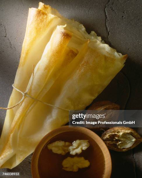 honey and walnut filo pastry cone - brique stock pictures, royalty-free photos & images