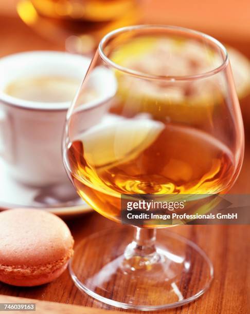 cup of coffe and glass of digestif - calvados brandy stock pictures, royalty-free photos & images