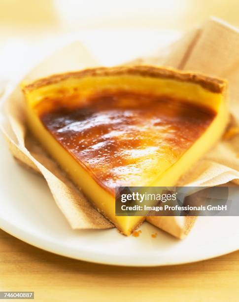 slice of egg custard tart - flan stock pictures, royalty-free photos & images